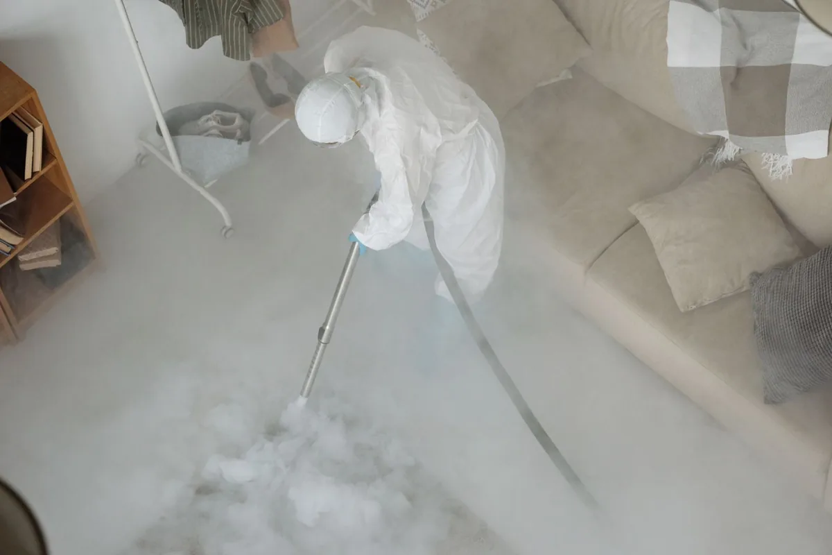 Biohazard cleanup technician in protective equipment, Grapeview, WA